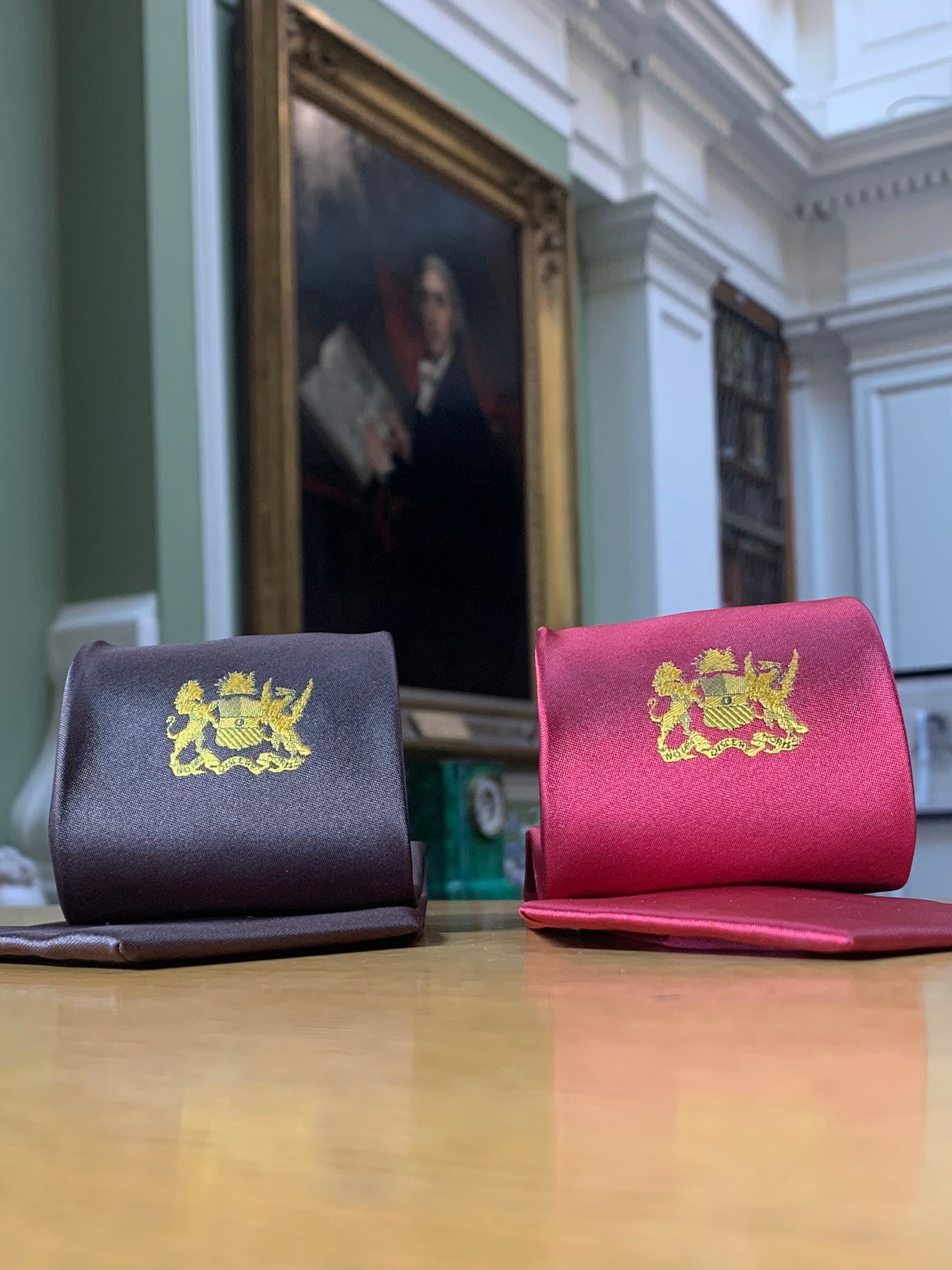 Red and brown ties with gold embroidered crests for the Linnean Society of London